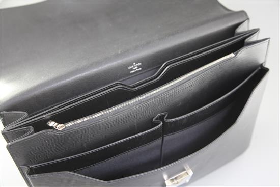 A Louis Vuitton black textured leather attaché case, 16.5in., with slip cover